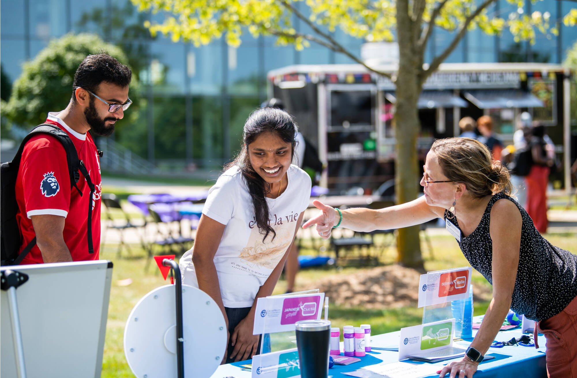 Aparna Devabhaktuni enjoys lawn games and music at the Global Laker Festival by the carillon tower, September 4.